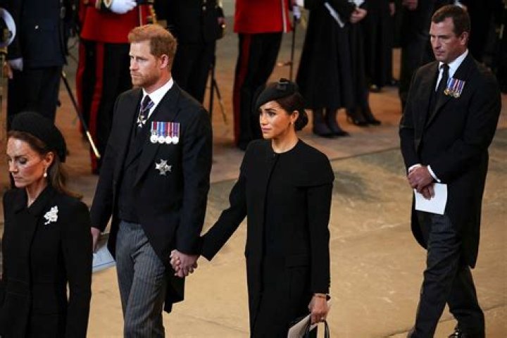 
Meghan Markle, Prince Harry Return to Site of Their Royal Wedding for Queen Elizabeth’s Funeral 
