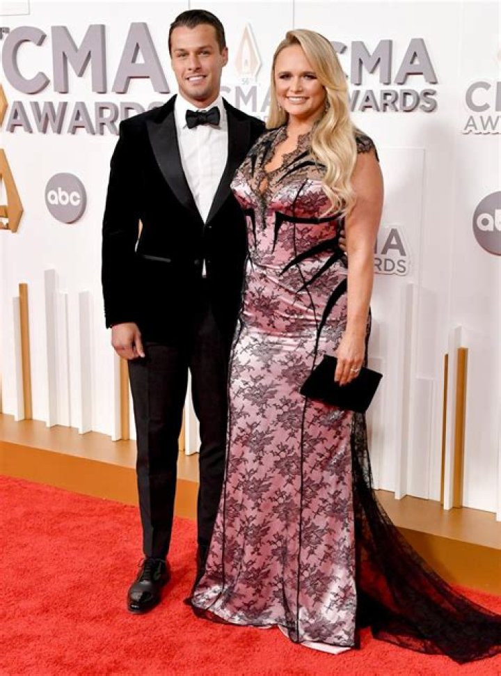 
Miranda Lambert Rocks 2022 CMAs Red Carpet in Black and Pink Dress with Husband Brendan McLoughlin 