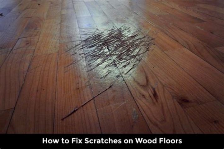 What home remedy removes scratches from wood floors